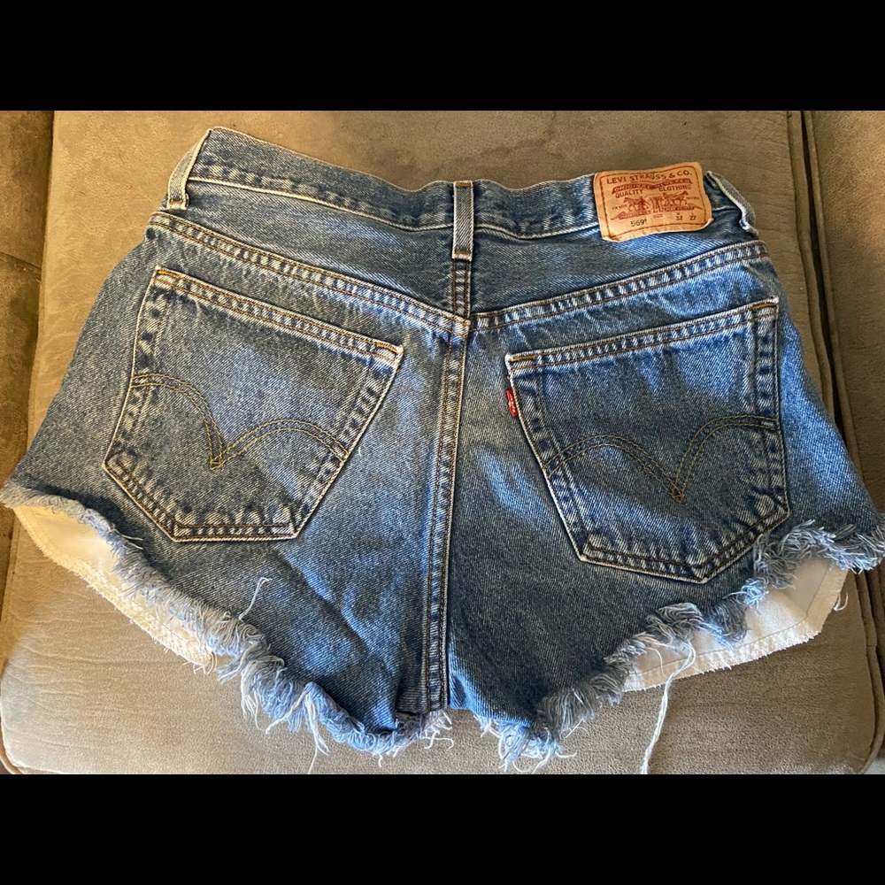 Perfectly cheeky and sexy LEVI distressed denim cut offs